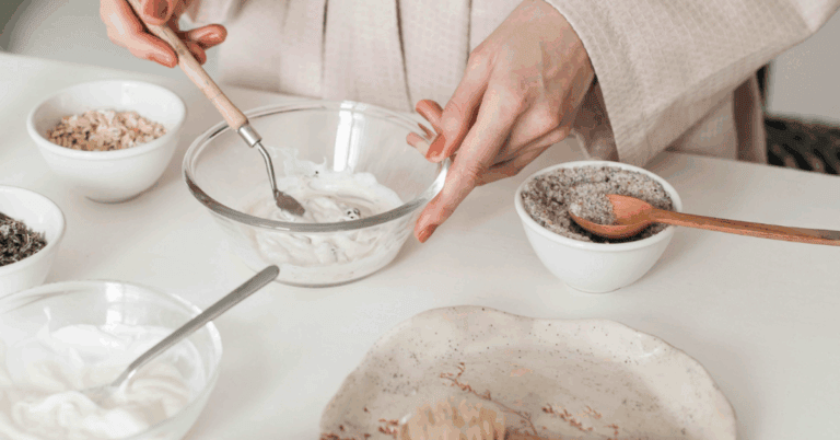 A woman making beef tallow moisturizer in her kitchen aisle.